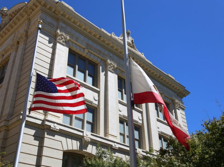 Flags fly at half-staff at Sacramento's City Hall.